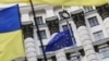 Ukraine -- Ukrainian national flags, flags of Ukrainian trade unions and EU flag are seen during a mass rally in front of the Ukrainian cabinet of ministers building in Kyiv, October 15, 2014