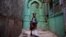 INDIA -- An Indian school girl walks in an alley in the old quarters of New Delhi, November 28, 2018